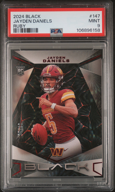 2024 Panini Black Jayden Daniels #147 Ruby /149 PSA 9